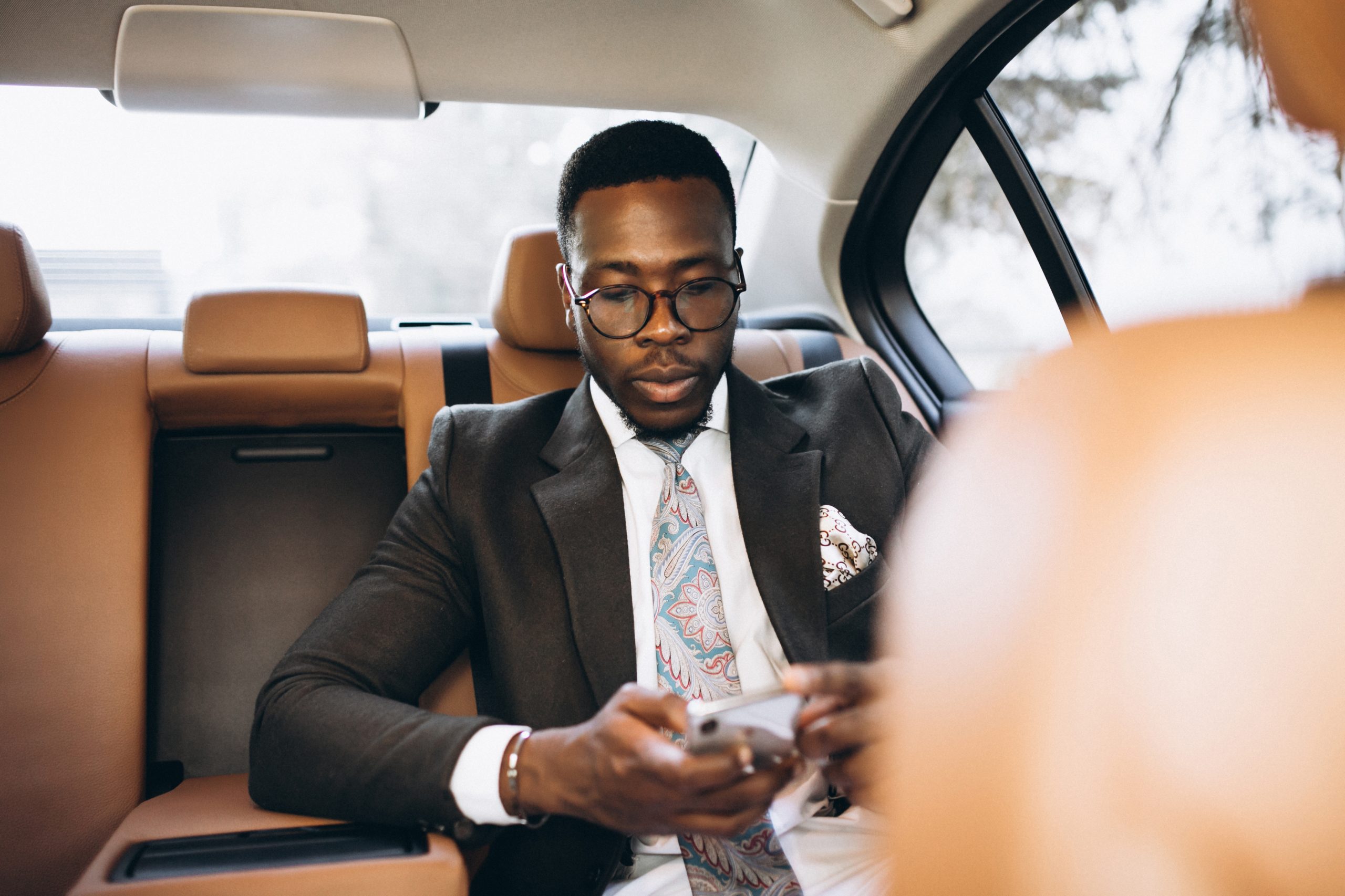 African american business man in car